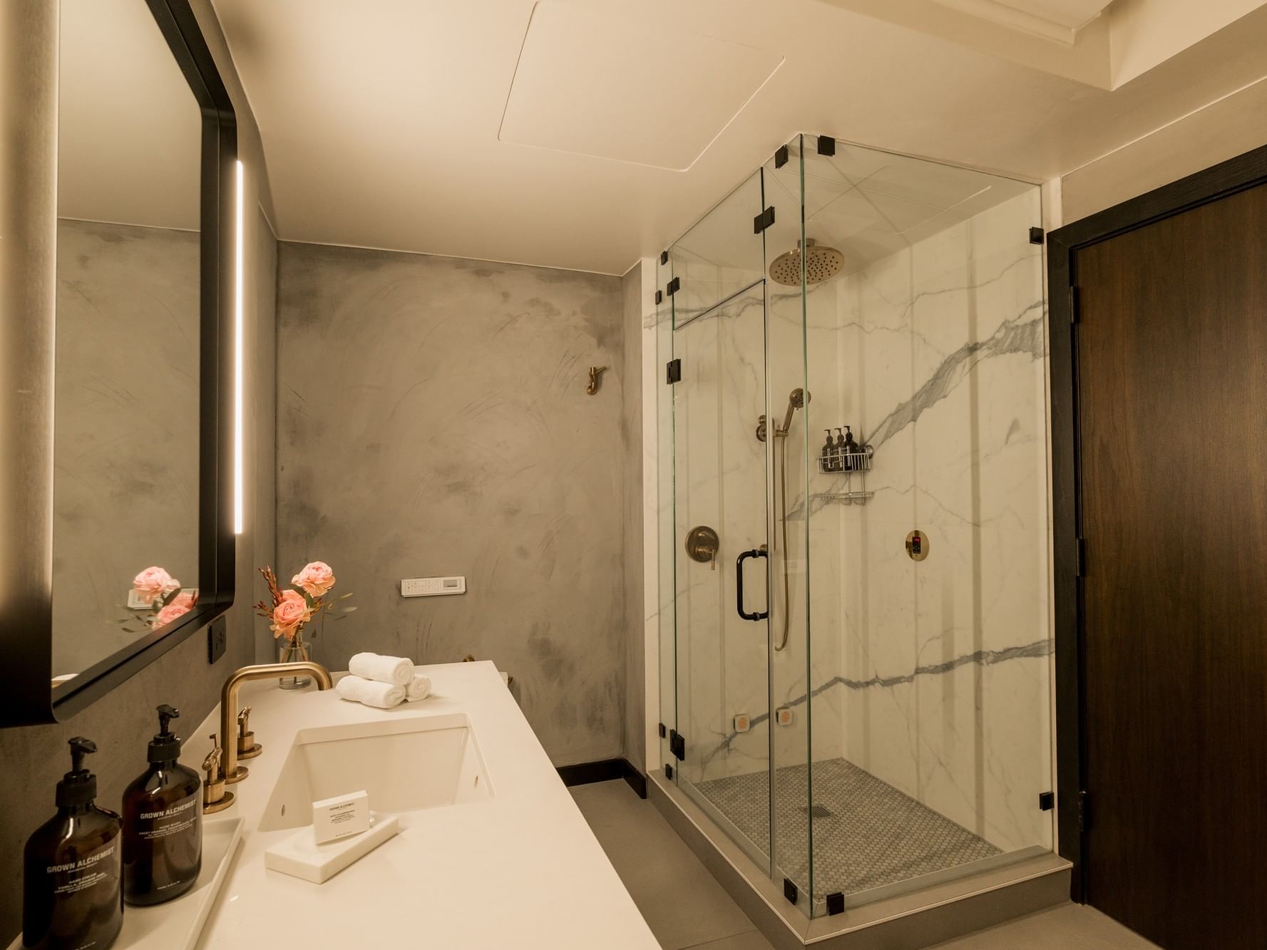 Gansevoort Meatpacking Duplex Penthouse Designed by Poliform. Second Floor Full Bathroom with Steam Shower, Deep Soaking Tub, and Grown Alchemist amenities.