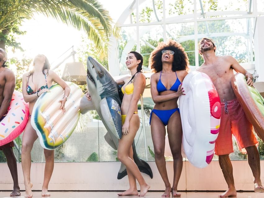 group-of-happy-friends-having-fun-at- swimweek pool-party