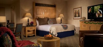 Comfortable guest room at Hilton Santa Fe Buffalo Thunder with a spacious bed and flat-screen television