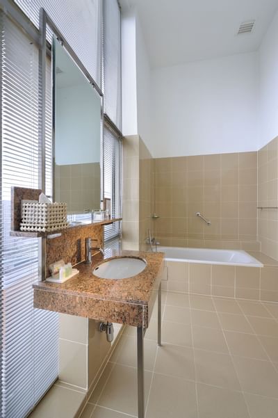 Bathroom tub & Vanity in a suite at Hotel Capitol Kuala Lumpur