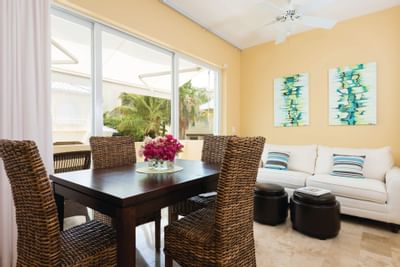Lliving room with white sofa in 1 Bedroom Junior Suite at Windsong Resort On The Reef