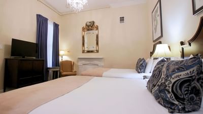 Twin beds & lounger in Junior Suite at Andrea Jackson Hotel