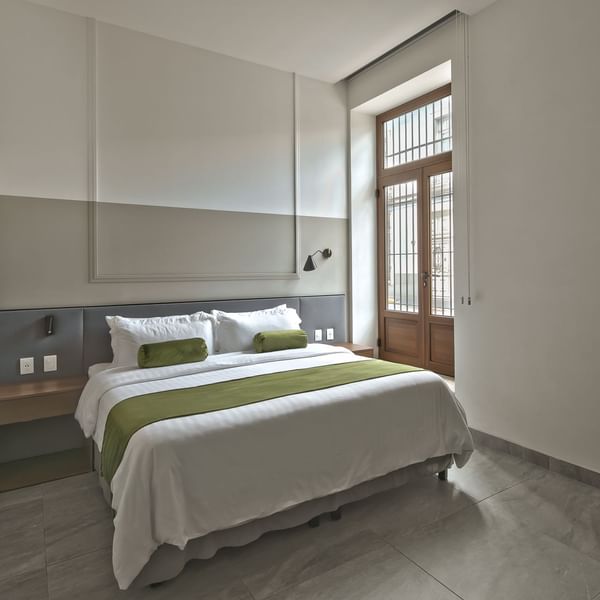 Large bed in the Superior Room at Gamma Hotels