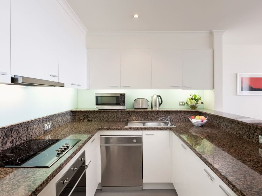 Inbuilt oven, stoves kitchen at Sebel Quay West Suites Sydney