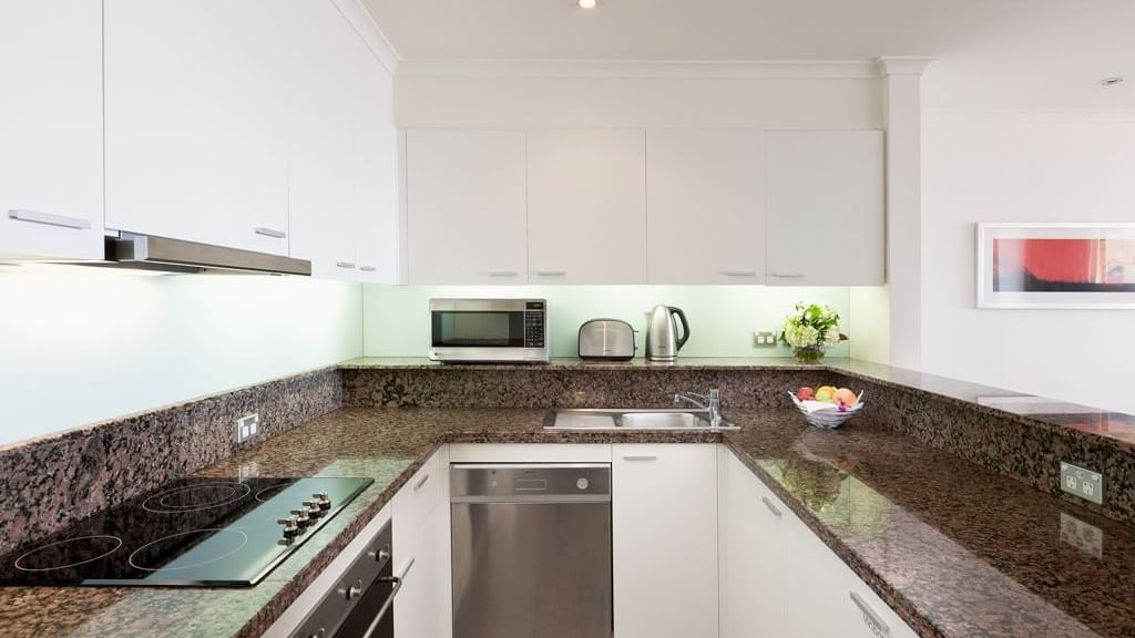 Inbuilt oven, stoves kitchen at Sebel Quay West Suites Sydney