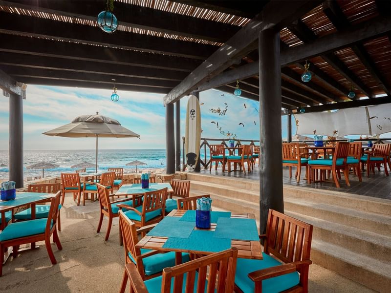 Open dining area in the restaurant overlooking the sea at Grand Fiesta Americana
