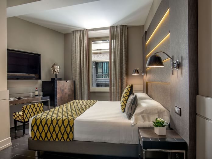 Interior of the Classic Room with a work desk by the king bed and window at The Style