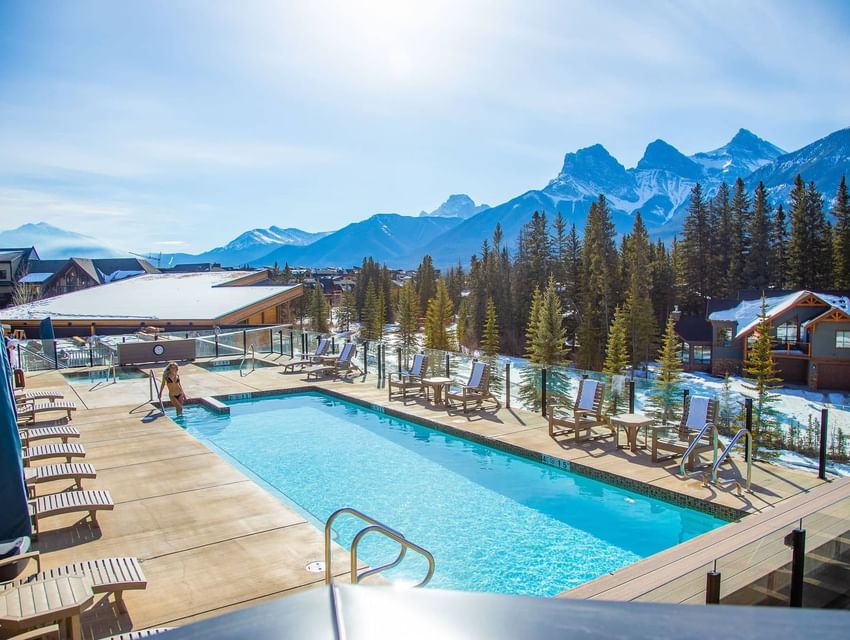 Balcony view of The Malcolm Hotel surrounded by mountains
