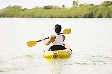 Adult paddling a kayak