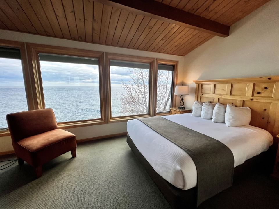 Queen bed, Chair in One Bedroom Elite Condo at Bluefin Bay