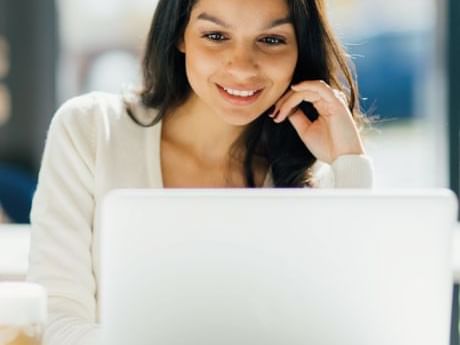 A lady working on the laptop at Curamoria Collection