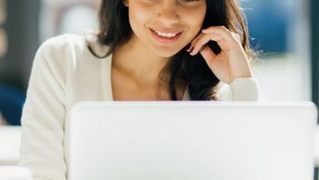 A lady working on a laptop at Live Aqua Urban Resort Monterrey