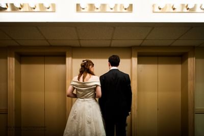 back of bride and groom at The Inn of Waterloo