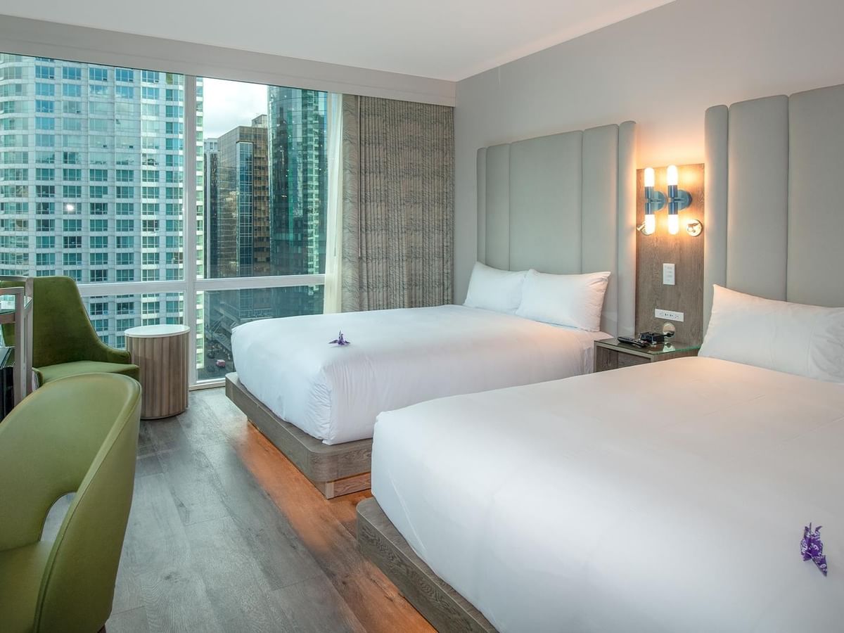 Hotel room with two queen beds and a large window