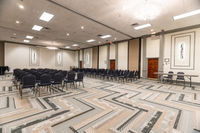 Theatre chairs with carpeted floors in McKinley Room at M Hotel Buffalo
