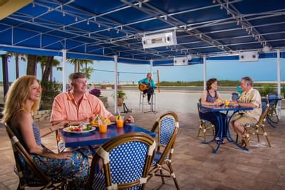 couples eating food outdoors