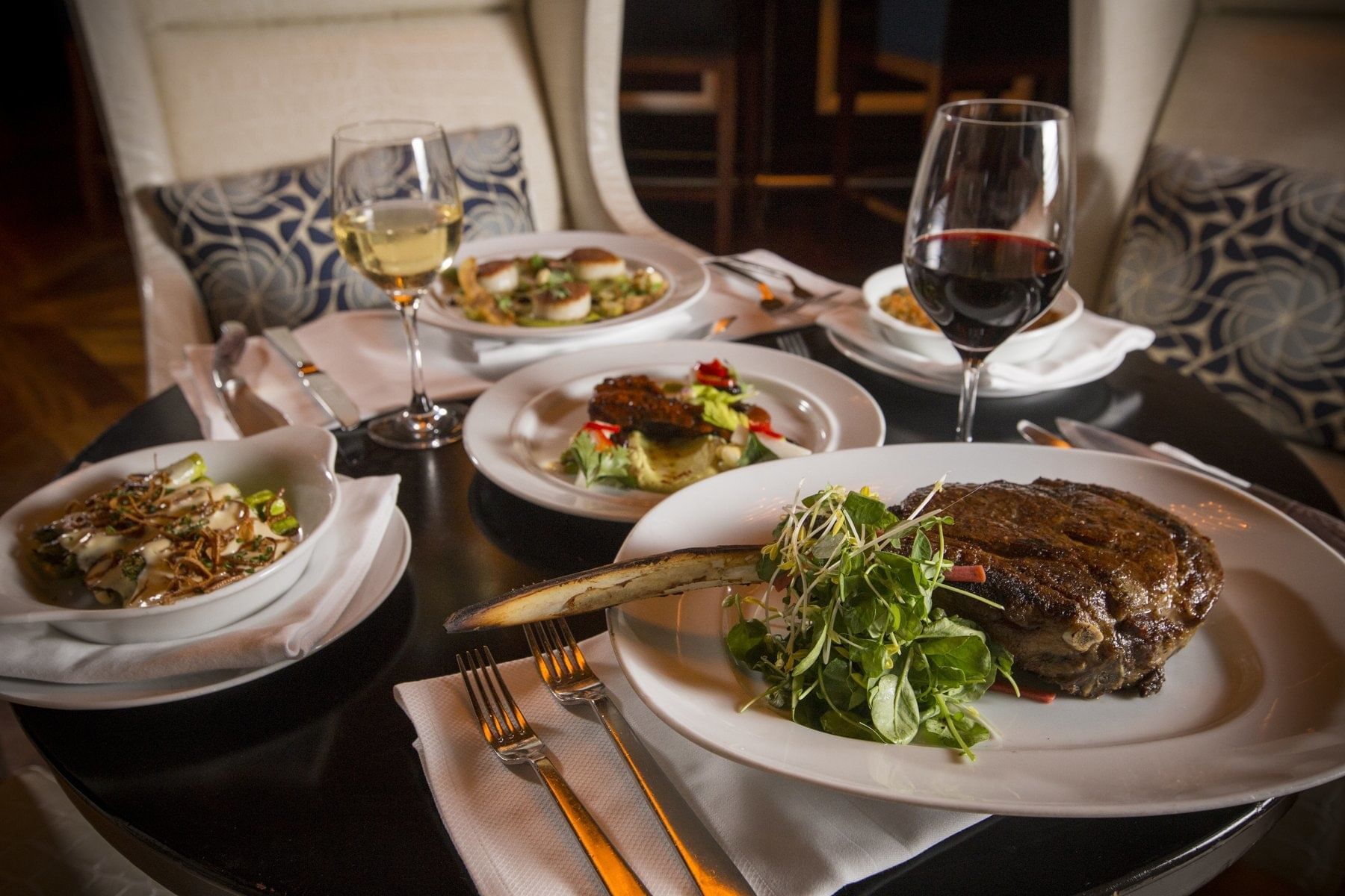 Fine dining dishes served with drinks at The Diplomat Resort