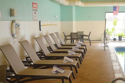 Lounge Chairs Next To Indoor Pool