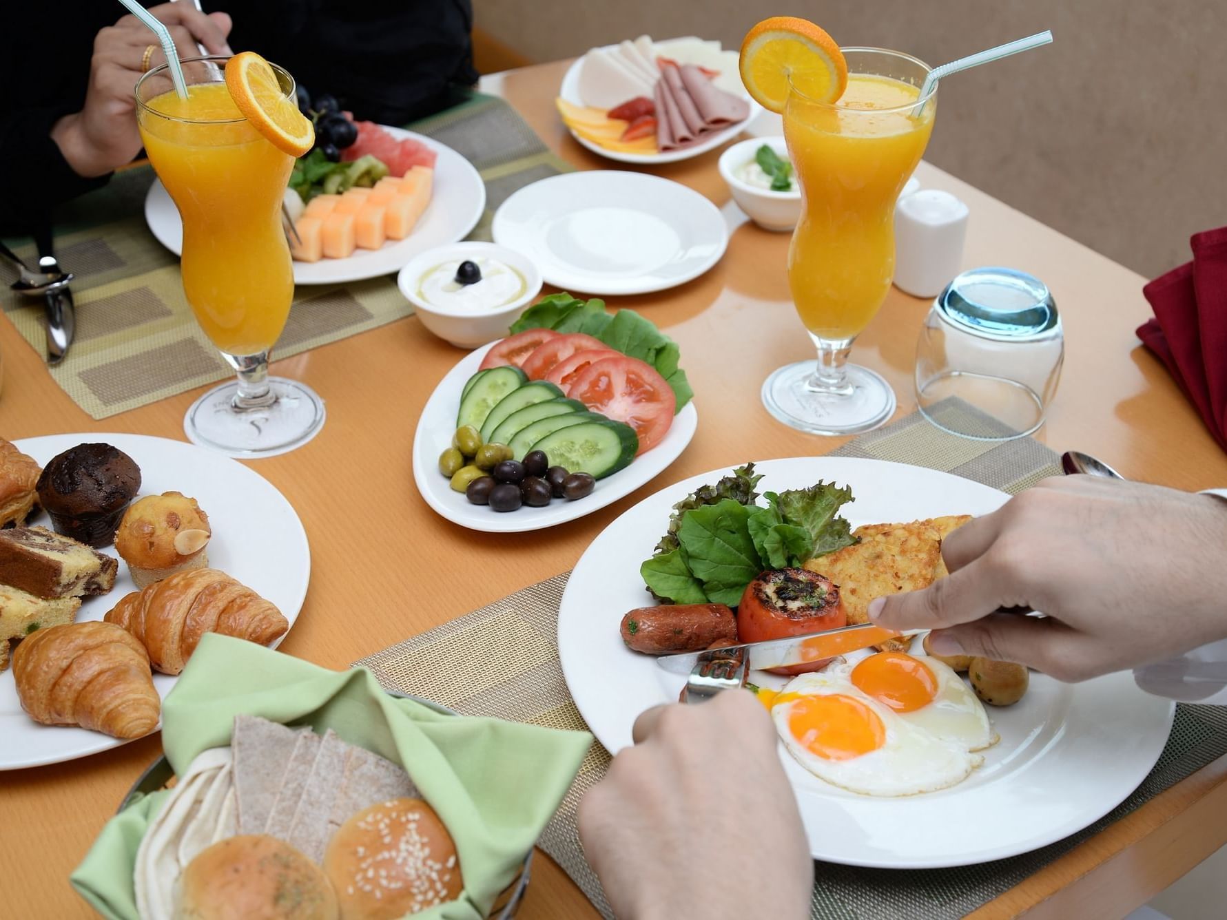 Couple having English Breakfast at City Seasons Hotels