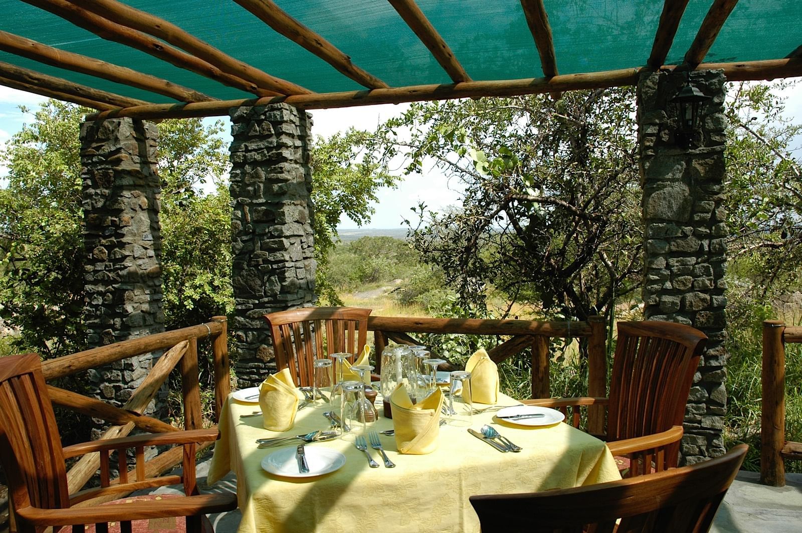 Dining table setup in Dinner room at Mbuzi Mawe Serena Camp