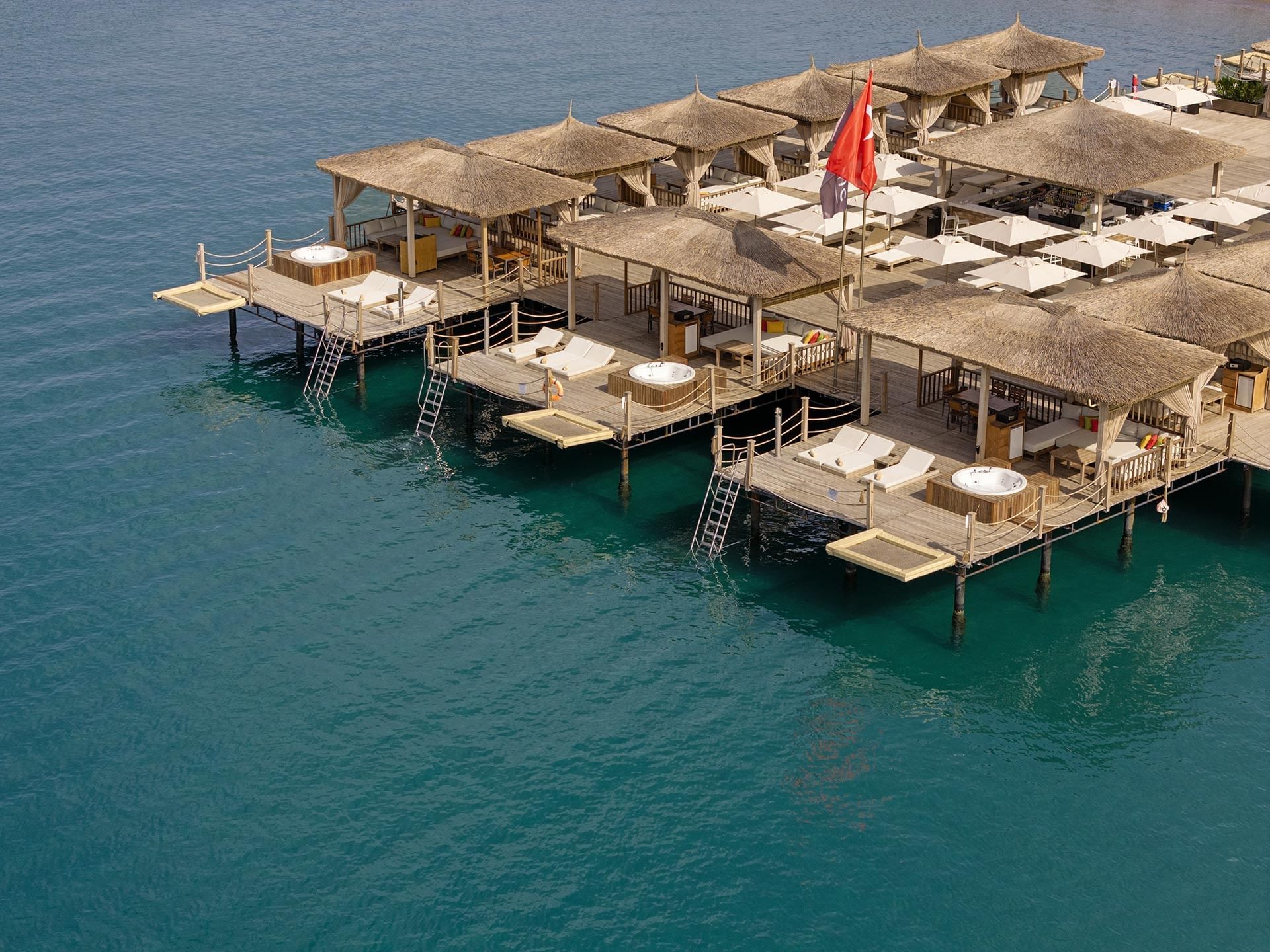 Aerial view of Pier Huts overlooking Lara Beach near Titanic Deluxe Lara