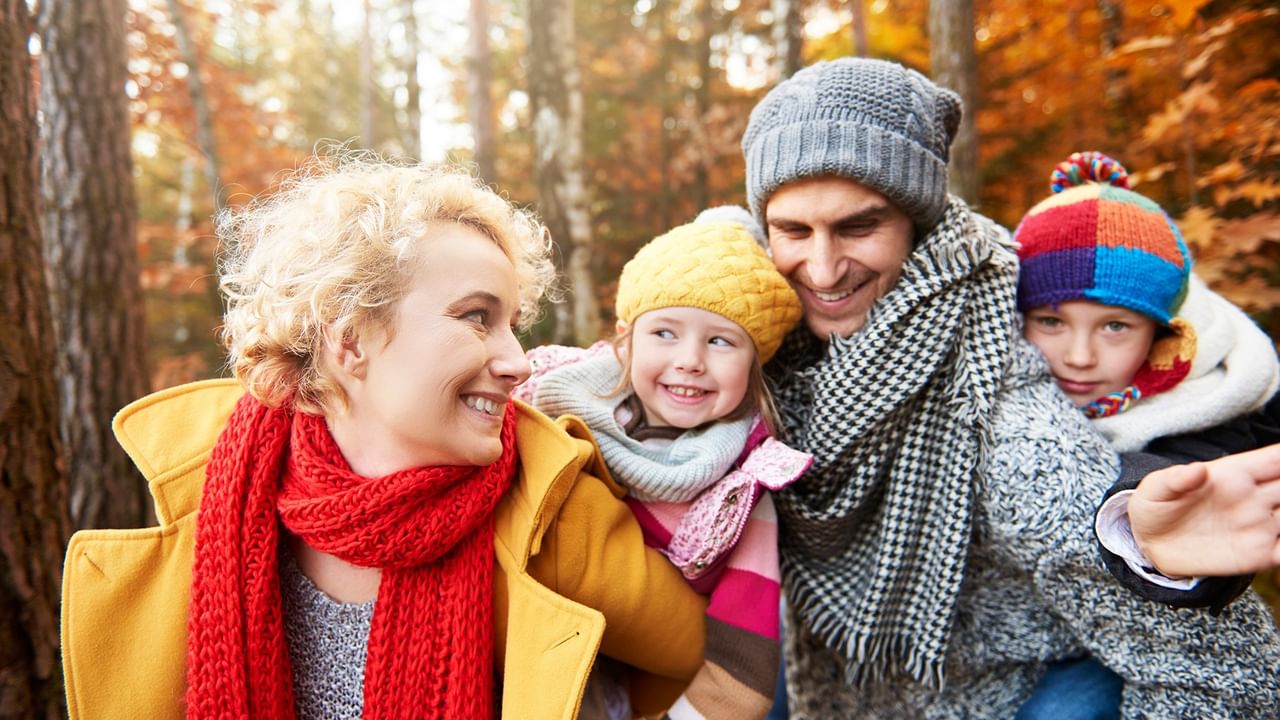 family enjoying autumn day in forest