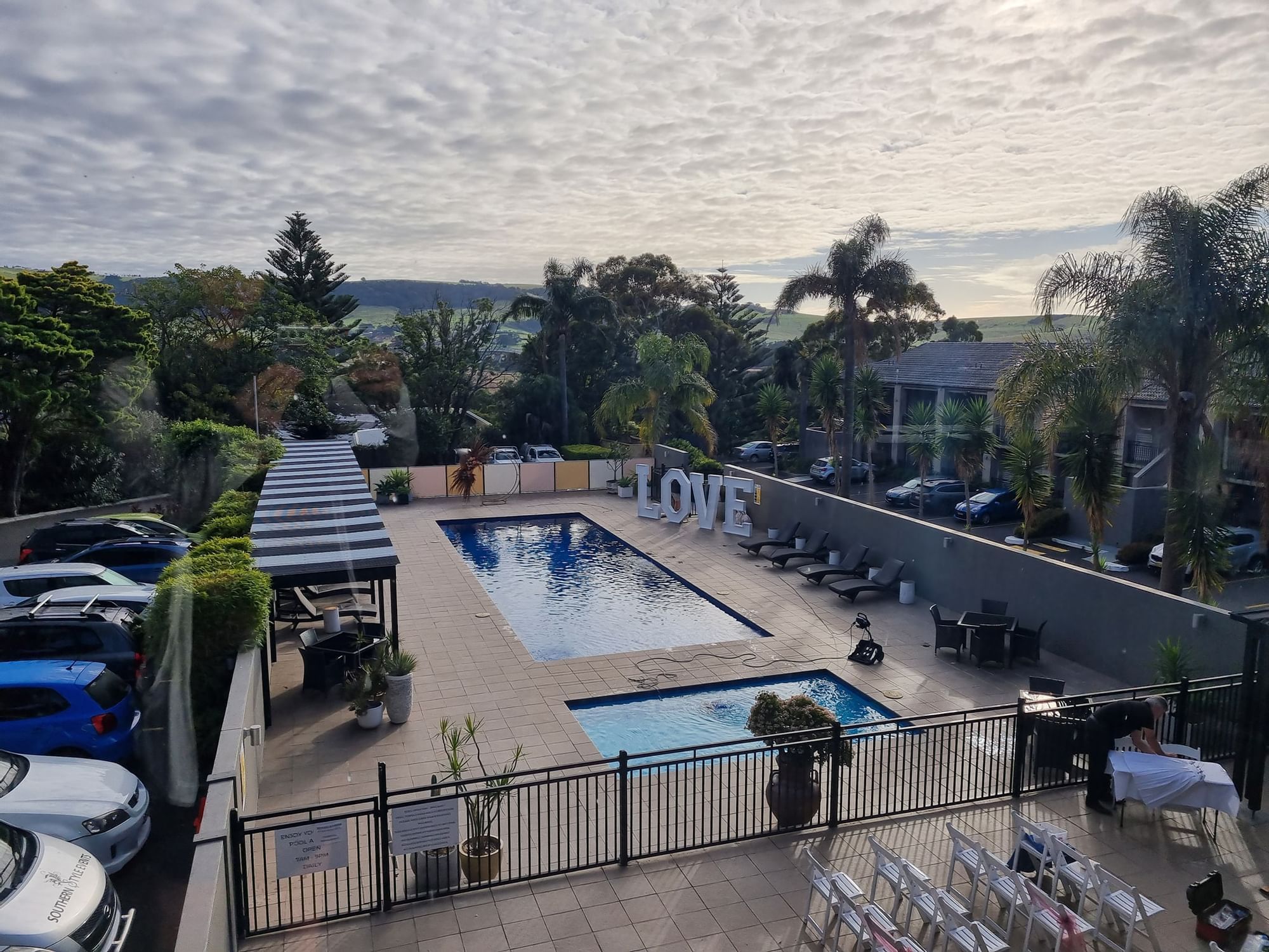 Aerial view of pool with sun loungers at Mercure Gerringong