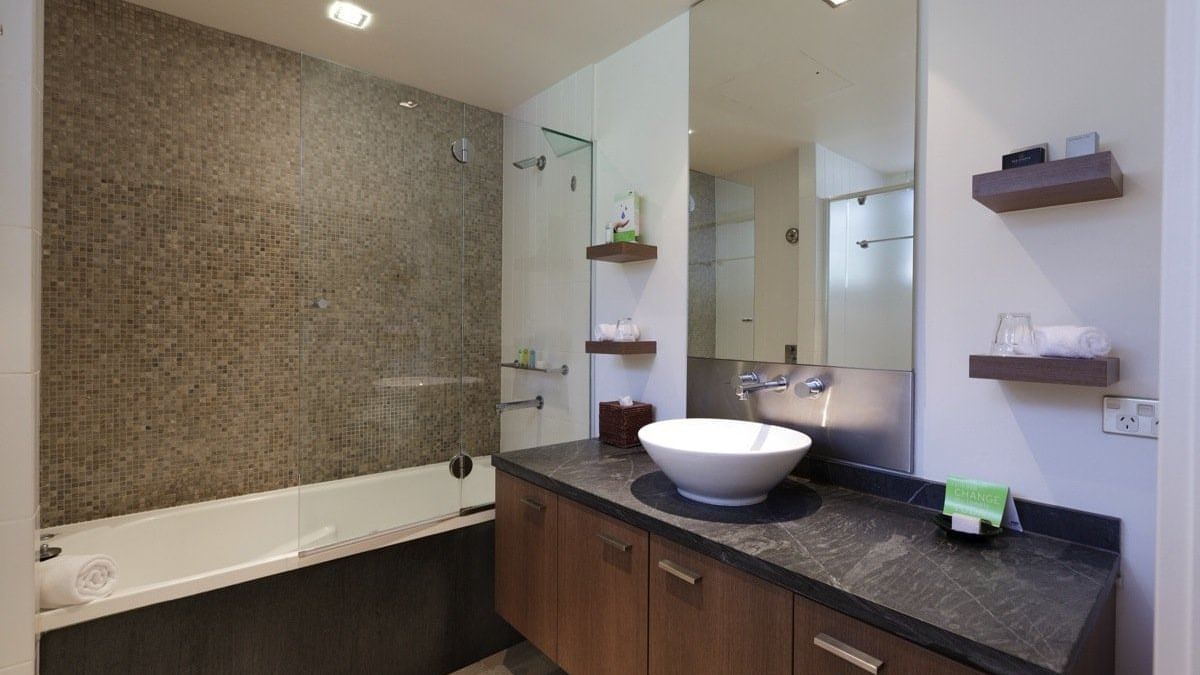 Bathroom in rooms at Pullman Palm Cove Sea Temple Resort & Spa