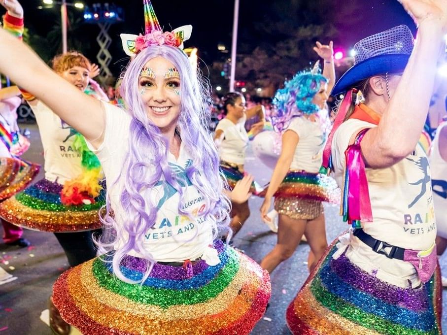 Participants in colorful costumes at the Sydney Mardi Gras 2026.