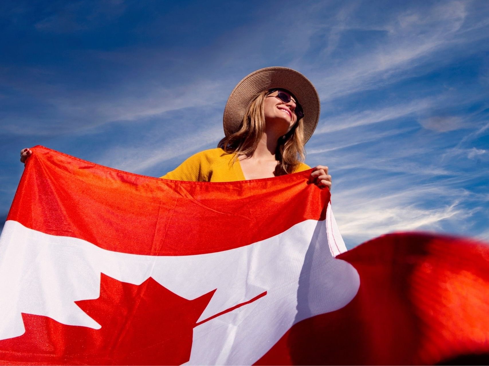 Woman holding Canadian flag