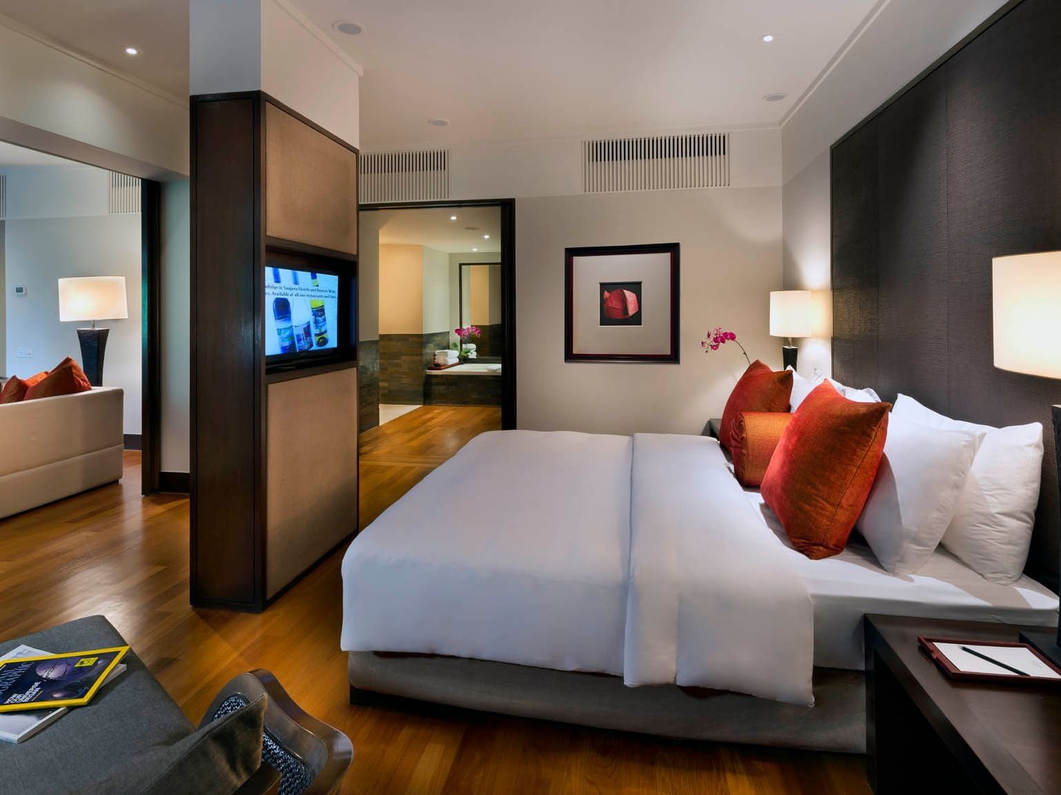 Modern Executive Room at The Saujana Hotel Kuala Lumpur with a plush bed, wooden floors, stylish decor, and a TV