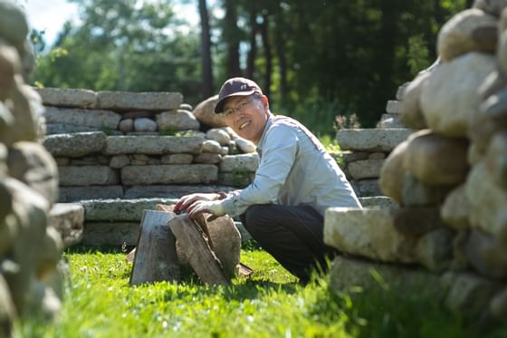 Man at the firepit of Kiva Garden near Honor's Haven Retreat