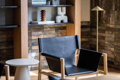 A box chair with a round table at Nesuto Docklands