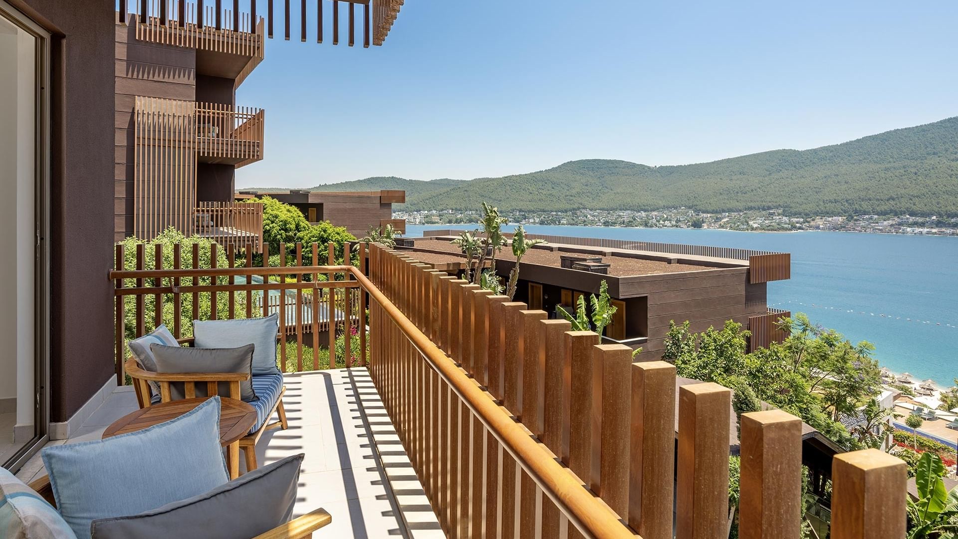 Sea view from the Superior Room's Balcony equipped with cozy chairs at Titanic Luxury Collection Bodrum