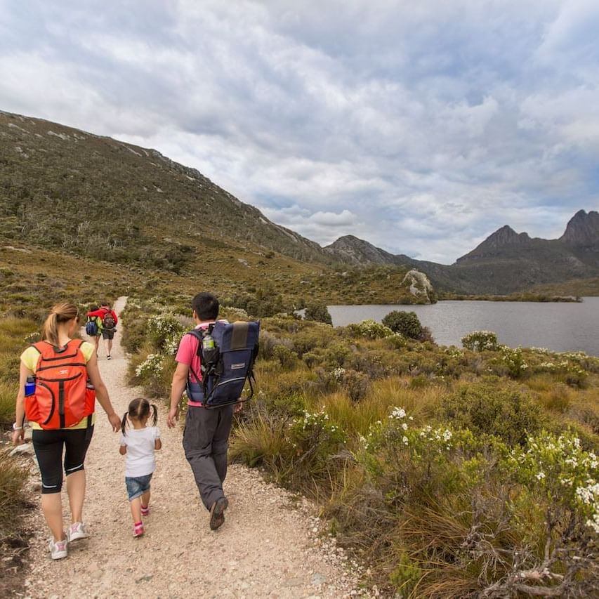 Family walking on the trails at Cradle Mountain Hotel