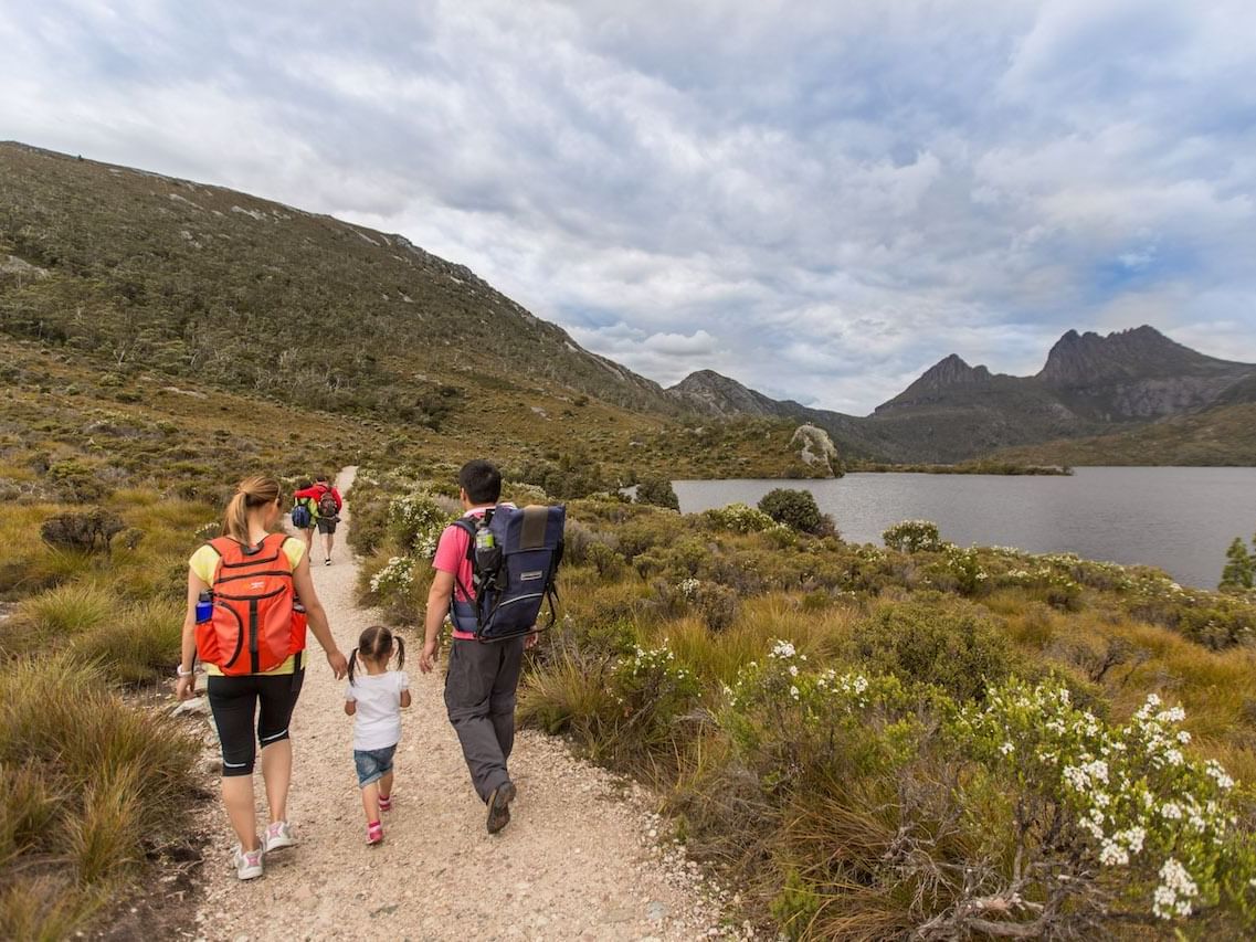 Family walking on the trails at Cradle Mountain Hotel