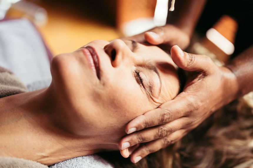 Close-up of a lady receiving a head massage at Liebes Rot Flueh