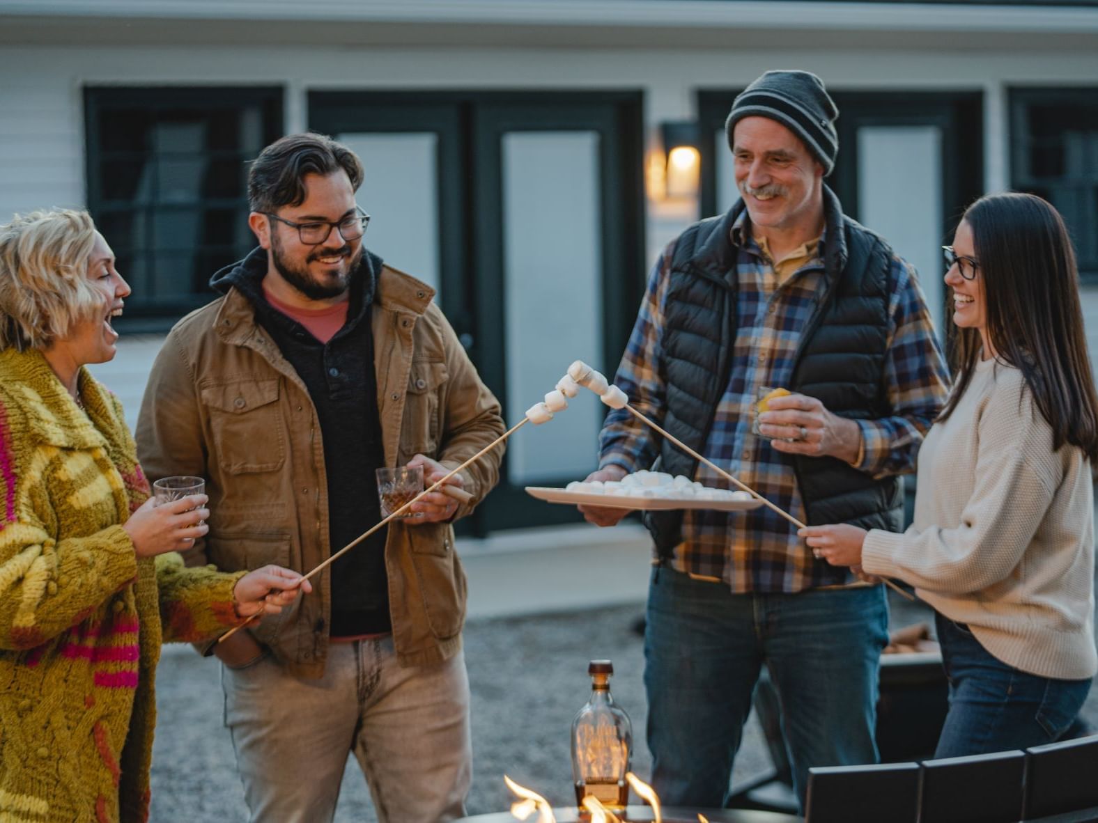 People burning marshmallows at Bardstown Motor Lodge courtyard