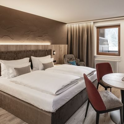 Large Bed in Smart Baby Room at Falkensteiner Hotels
