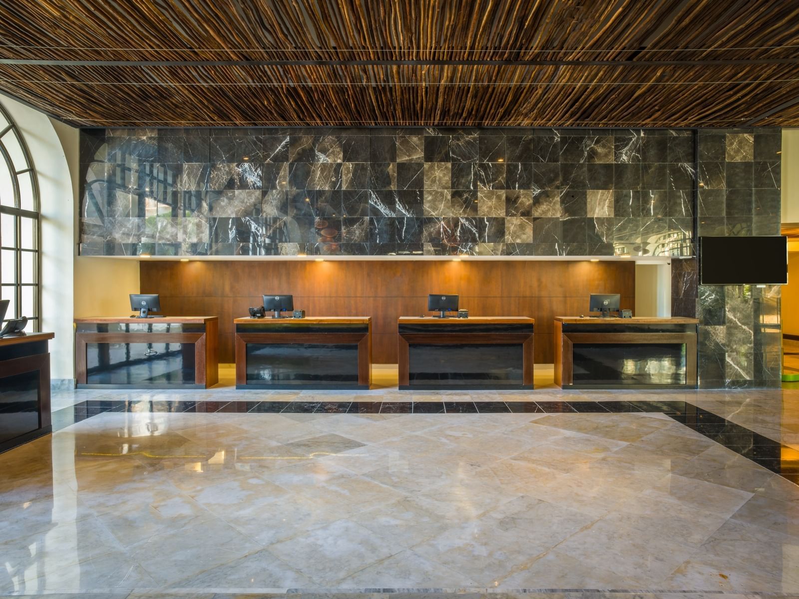 Reception desks in the lobby at La Colección Resorts