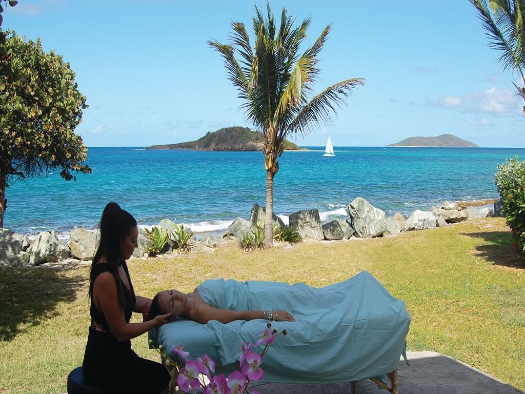 Beach massage by the beach at Tamarind Reef Resort