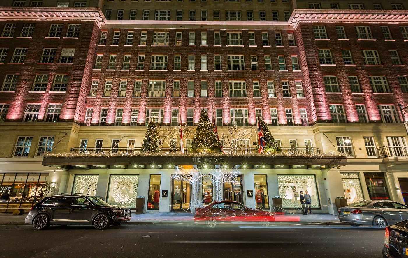 Exterior view of The May Fair Hotel at night