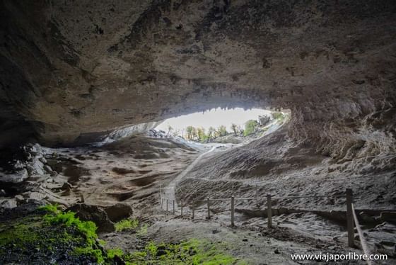 Landscape view of The Milodon Cave entrance near NOI Indigo