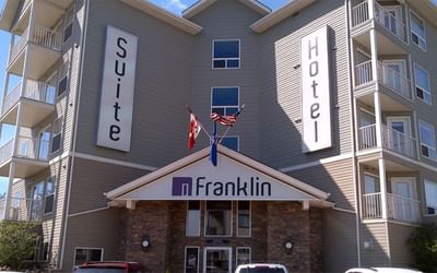 Low angle exterior view of Franklin Suite Hotel & entrance, Fort MacMurray Hotels