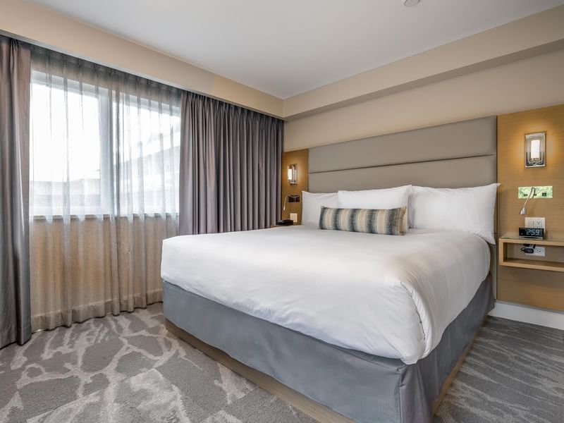 Bedroom with a king bed in our Coast King Suite