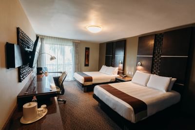 Bed & lounge area in Standard Room Double at Araiza Mexicali