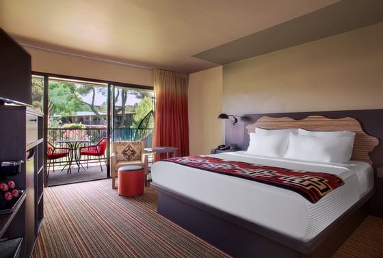 Courtyard suite hotel room, king bed and view of Red Rocks.