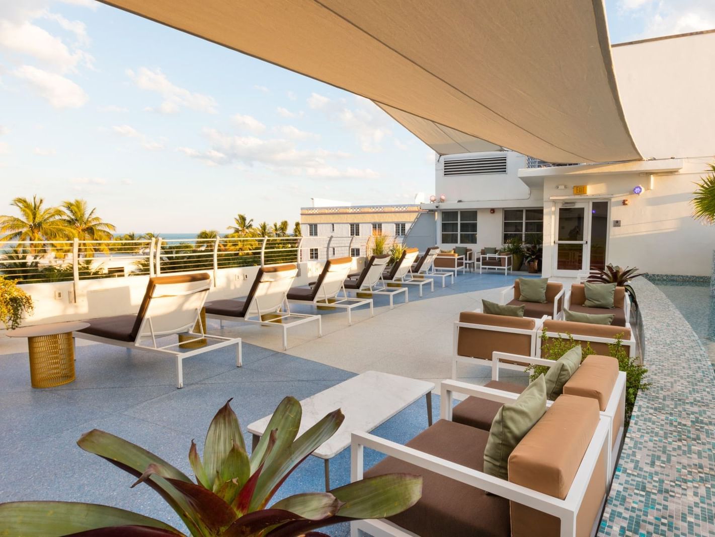 Rooftop terrace with lounging area at Essex House Hotel