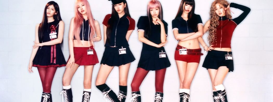 Group of seven women posing for picture wearing uniforms at IVE World Tour 2026.