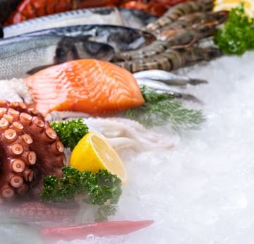 Yamas Greek Restaurant at Titanic Deluxe Lara - Fresh seafood display, Mediterranean cuisine, and vibrant Sirtaki dance show